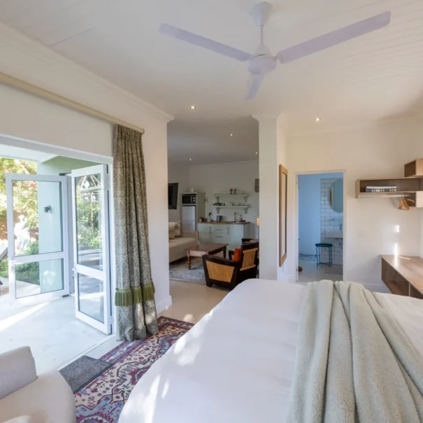 Spekboom Cottage at 81 On Church, the bed facing open doors to the garden