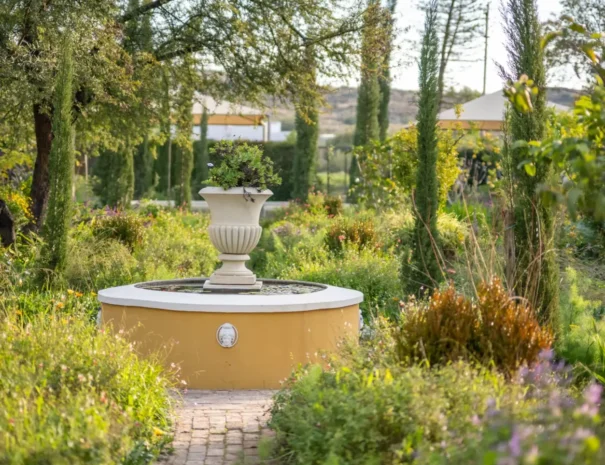 The formal garden at 81 On Church, with fountain and cypress trees