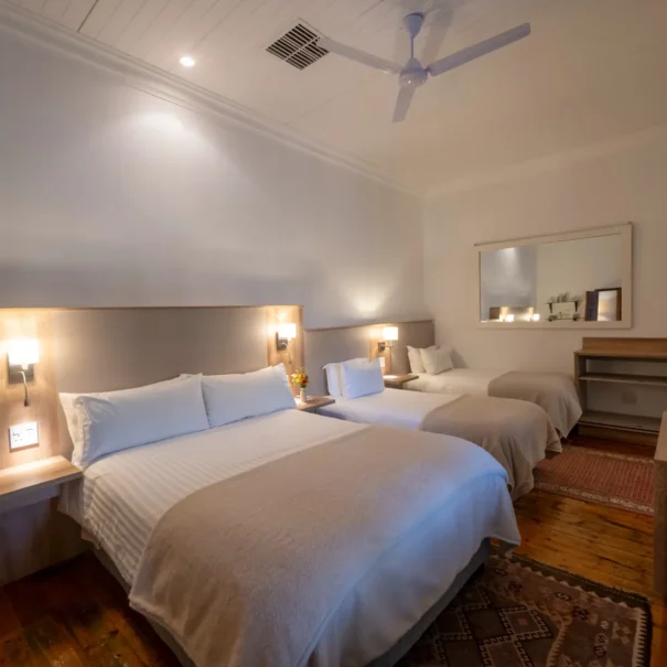 The Family Room at 81 On Church, with a queen bed and two singles